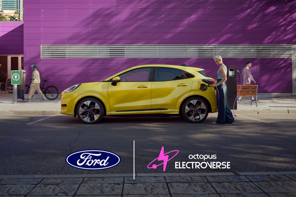 alt="Side view of a yellow electric Ford Puma Gen-E plugged into a public charging point."