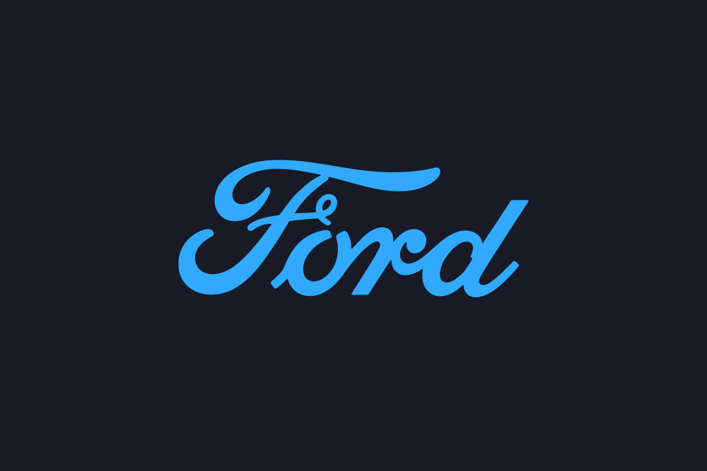 Logo Ford v modrém písmu na tmavém pozadí.